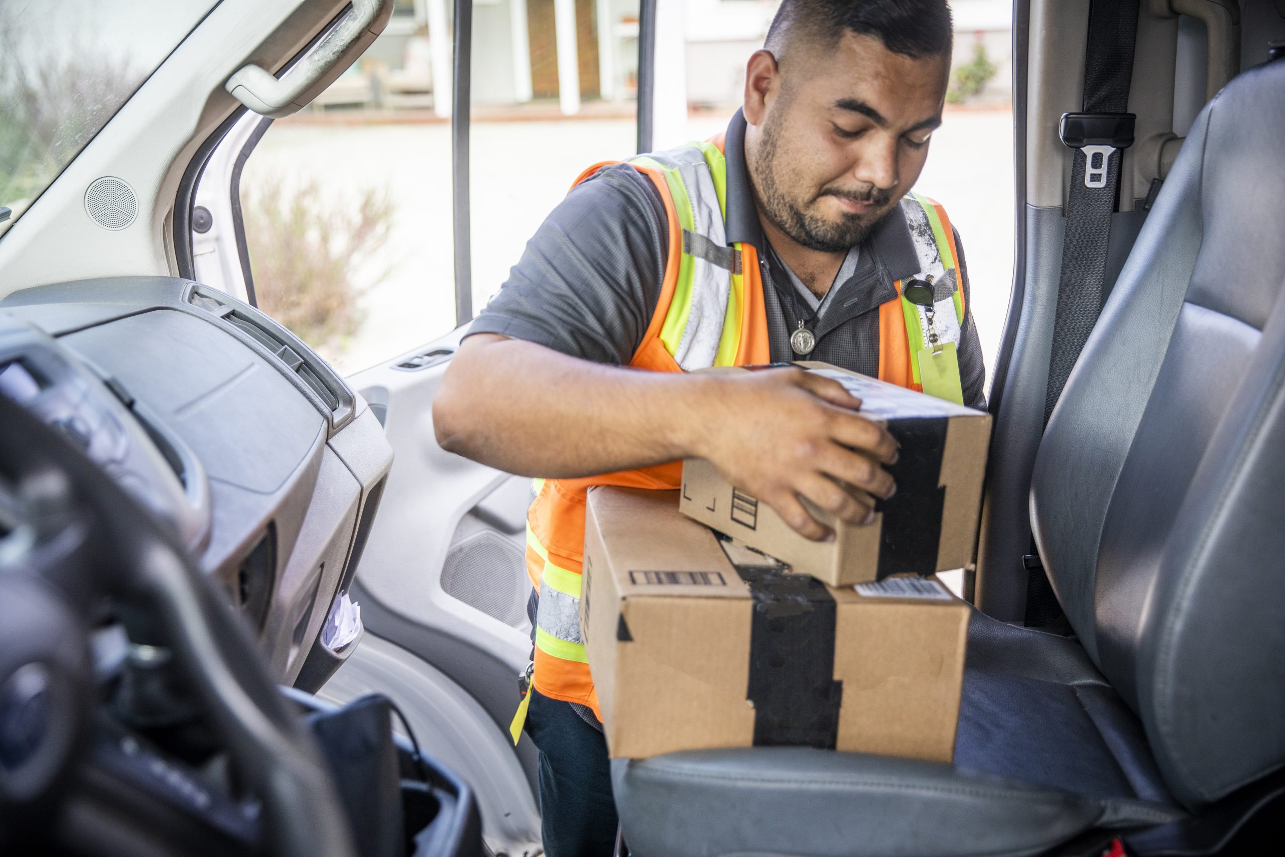 Delivery Man Taking Packages from Vehicle